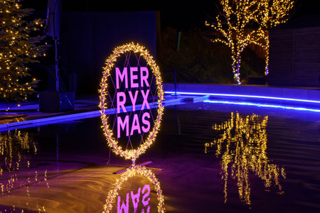 Colorful christmas lights with Merry Christmas on traditional xmas Market in Germany.
