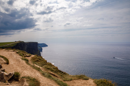 Spectacular Cliffs of Moher are sea cliffs located at the southwestern edge of the Burren region in County Clare, Ireland. Wild Atlantic wayの写真素材