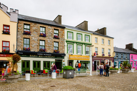 CLIFDEN, IRELAND - 16 July, 2019: Awesome and colorful streets of Clifden, Connemara, Ireland. Colourful houses, doors, pubs, windows with flowers.のeditorial素材