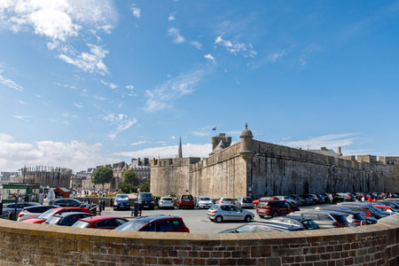 ST MALO, FRANCE - August 24, 2022: St Malo, France. View over the walled city Saint-Malo medieval pirate fortress, St Vincent Cathedral and lighthouse from the sea in Summer Daytime, Brittanyのeditorial素材
