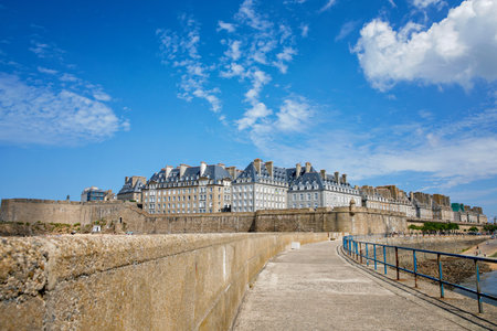 St Malo, France. View over the walled city Saint-Malo medieval pirate fortress, St Vincent Cathedral and lighthouse from the sea in Summer Daytime, Brittanyの写真素材