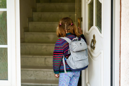 Cute little preschool girl o the way to school Healthy happy child with eyeglasses walking to...