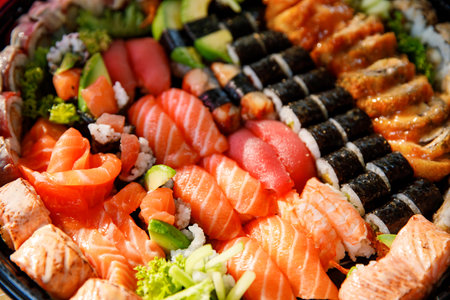 Assorted Sushi Nigiri and Maki Big Set on Slate. A Variety of Japanese Sushi with Tuna, Crab, Salmon, Eel, and Rolls. Top View.の写真素材