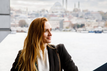 Woman travel in Istanbul near Hagia Sophia famous islamic Landmark mosque, Travel to Istanbul, Turkey background.の写真素材