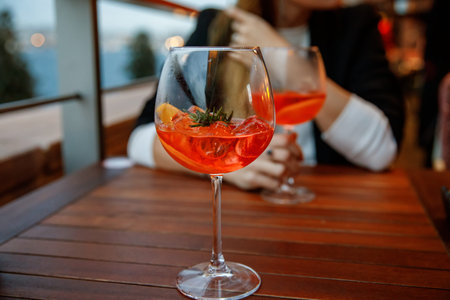 two aperol spritz on a summer evening in a mediterranean restaurant.
