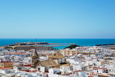 Aerial panoramic view of the old city rooftops and Cathedral de Santa Cruz in the afternoon from tower Tavira in Cadiz, Andalusia, Spainの写真素材