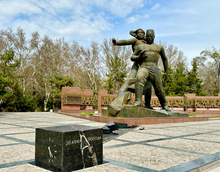 Tashkent, Uzbekistan - 26 March 2024: Monument Courage devoted to earthquake of 1966 resquers builders reconstructing Tashkent. Words on black cube 26 April 1966 date of disasterのeditorial素材