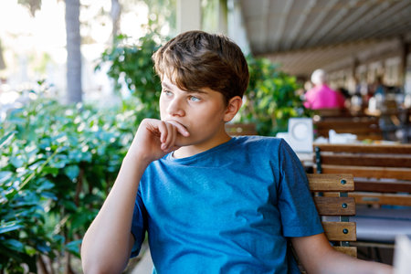 Portrait of preteen school kid boy. Beautiful happy child looking at the camera. Schoolboy smiling. Education concept.の写真素材