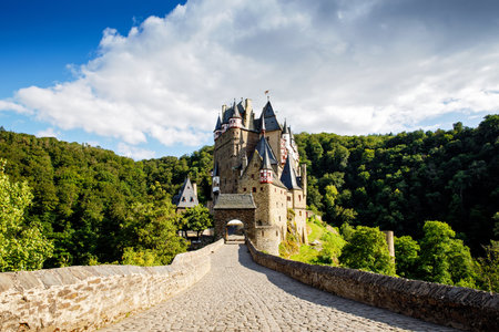 Eltz Castle, a medieval castle located in Germany, Rheinland Pfalz, Mosel region. Beautiful old castle, famous tourist attraction on sunny summer day, empty, without people, nobody.の写真素材