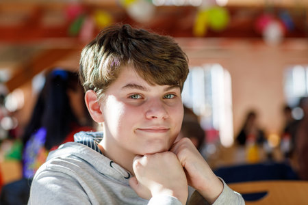 Portrait of preteen school kid boy. Beautiful happy child looking at the camera. Schoolboy smiling. Education concept.の写真素材