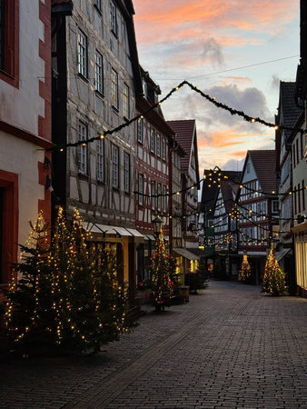 Old market place in Alsfeld, Hesse, Germany with the Christmas decoration, old houses with stores,...