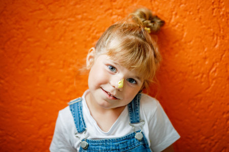 Cute little toddler girl in new house. Happy child girl, having fun indoors