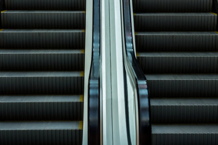 Stairs of the escalator, moving up and down.