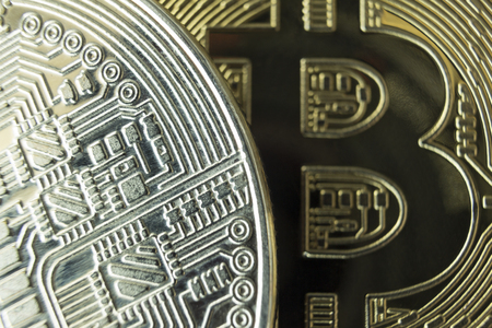 Macro close-up of silver and gold bitcoins.の写真素材