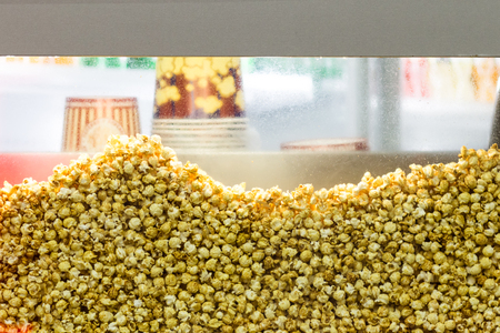 Transparent showcase filled with popcorn background texture.の写真素材