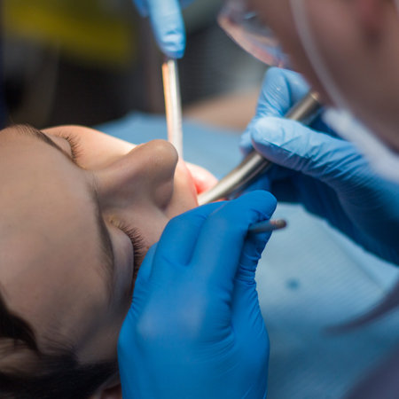A teenager in dentistry at a dentists appointment. Treatment of teeth. A square picture.