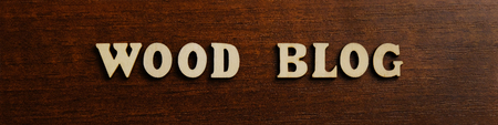 An inscription WOOD BLOG.made of wooden letters against the texture of a dark brown wood.の写真素材