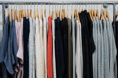 Background for concept shopping and discounts.Choosing fashionable clothes of different colors on...