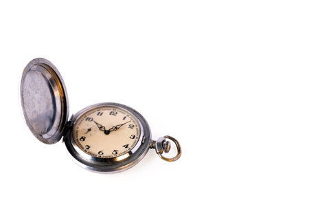 Old retro pocket watch with scratches isolated on a white background. Object for design on the theme...