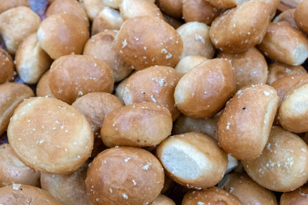 Background from round bakery products. Lots of garlic buns.
