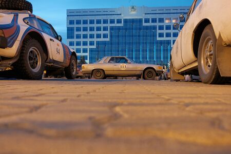 Kazakhstan, Kostanay, 19-06-19, Rally Peking to Paris. Mercedes, Porsche and other cars in the town square. Parking retro cars for the night.のeditorial素材
