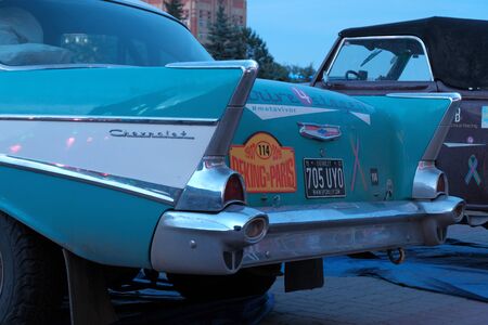 Kazakhstan, Kostanay, 2019-06-20, Retro car Chevrolet with a sticker of the participant racing number 114. Rear view. Close-up. The 7th Peking to Paris Rally Motor Challenge.のeditorial素材