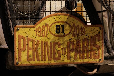 Kazakhstan, Kostanay, 19-06-19, The plate of the participant of the international car race with the number 81, covered with broken insects. Peking to Paris. Rally.のeditorial素材