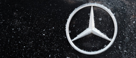 Kazakhstan, Kostanay, 2019-01-19. Mercedes iconic logotype covered with snow flakes. Winter....