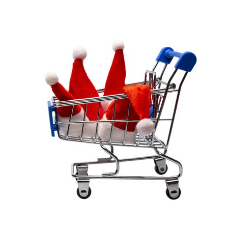 Family Christmas purchases or New Year group discounts at the supermarket or online store. Four Santa Claus hats in a shopping trolley. Consumer basket of winter holidays. Isolated. Object for advertising.の写真素材