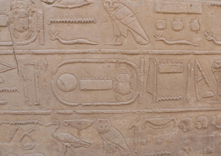 Ancient Egyptian hieroglyphics and reliefs