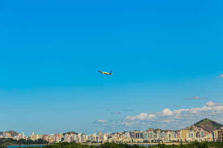 Vitoria / Brazil - April 10 2021: Aerial view of AZUL AIRLINES Embraer 190 takeoff run Vitoria Airport (VIX / SBVT). Camburi beach in the background.のeditorial素材