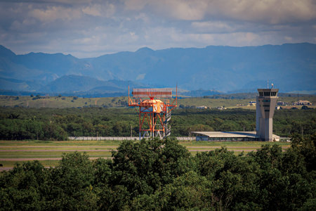 Radar at Vitoria airport in operation. Airport control tower on the side.