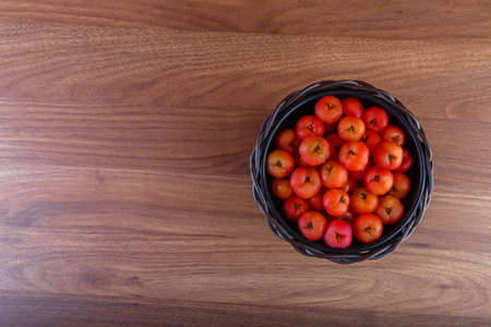 Acerolas in raw form in a straw pot - top view.の写真素材