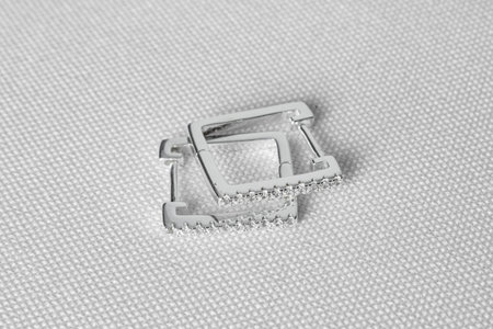 Elegant silver earring jewelry with gemstones with square shape. White background. One pair.の写真素材