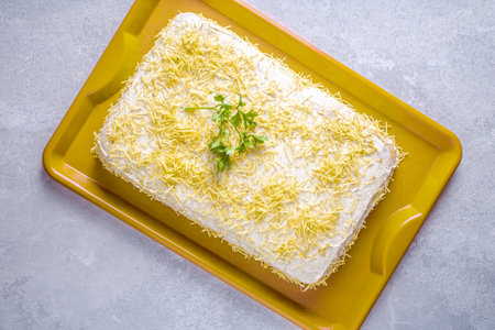 Chilled salty chicken pie, typical Brazilian dish. In a golden shape, gray wooden background and coriander detail on the pie. Top view.の写真素材