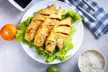 Fried peroa fish, lettuce salad, tomato, lemon, rice, beans and passion fruit juice. Traditional...