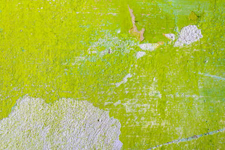 Green repair wall background with scratch and piece of paper. Rough housework wallpaper design backdrop. Color room interior decoration texture templateの写真素材