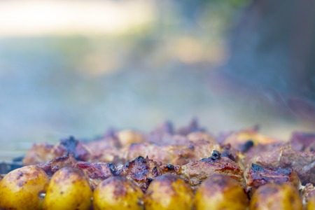 potatoes and meat barbecue cookingの写真素材