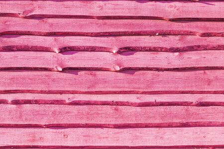 Old pink wood plank background. Wall floor or fence exterior design. Natural wooden material backdropの写真素材