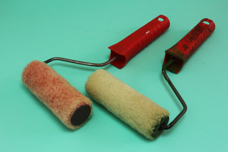 Painting brushes rolls in a green backgroundの写真素材