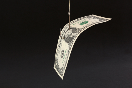 Money bait in a black backgroundの写真素材