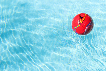 Red ball in the swimming pool