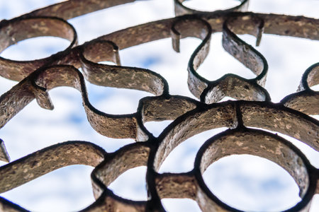Steel cage pattern Against the backdrop of the sky.