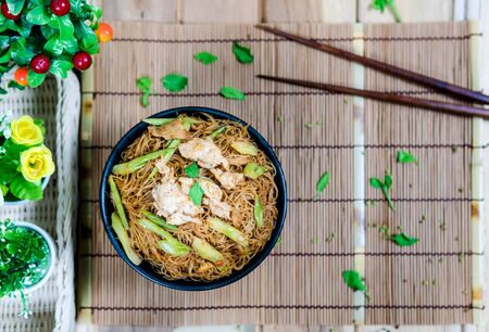 Fried noodle with pork and misaligned with the placement.の写真素材