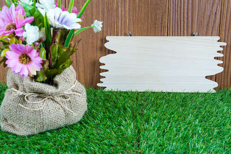 Grass with flowers and banners, the natural  of wood.の写真素材