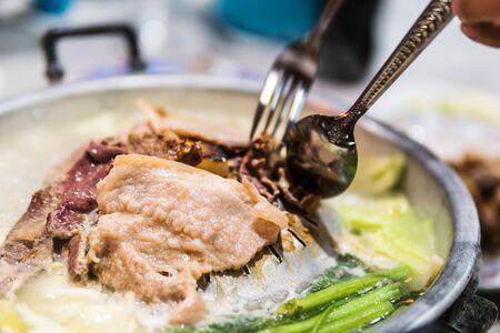 Pork slices are grilled on the pan. The grill is perfect for parties. And popular in Thailand.の写真素材