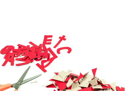 Cut the paper into words ETC The study And use scissors to cut paper A white backgroundの写真素材