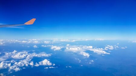 View of the aircraft that we're traveling to tourism.And the blue sky and the clouds that look beautiful.の写真素材