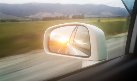 nature of the sunlight The view through the glass side of the car.And the orange light in the...
