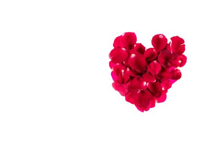 Petaled rose colored flowers that are arranged together to form a heart. And gave each other in important dates. And a white background ( clipping path )の写真素材